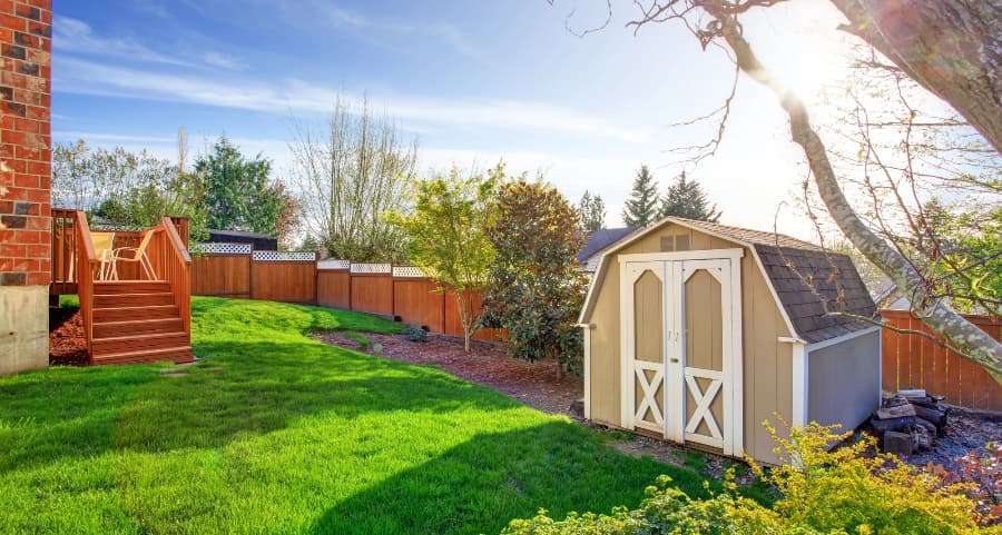 Fenced backyard with storage shed in Harrisburg